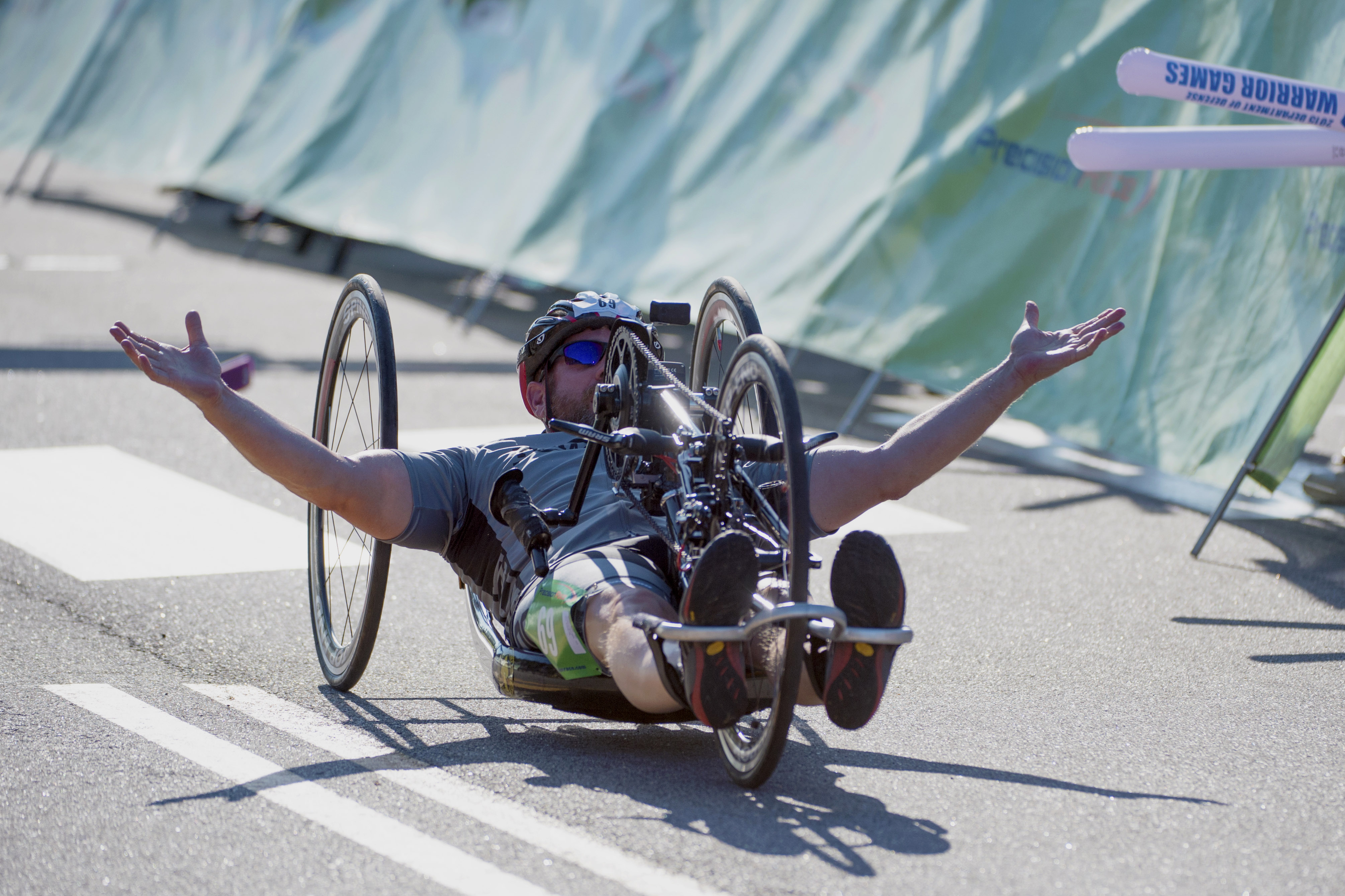 Special Operations Command Team’s David Neumer crosses the finish line for gold in the Men’s Open Hand Cycle Division during the 2015 Department of Defense Warrior Games at Marine Corps Base Quantico June 21, 2015. Jimenez won gold in the Men’s H5 Hand Cycle Division.