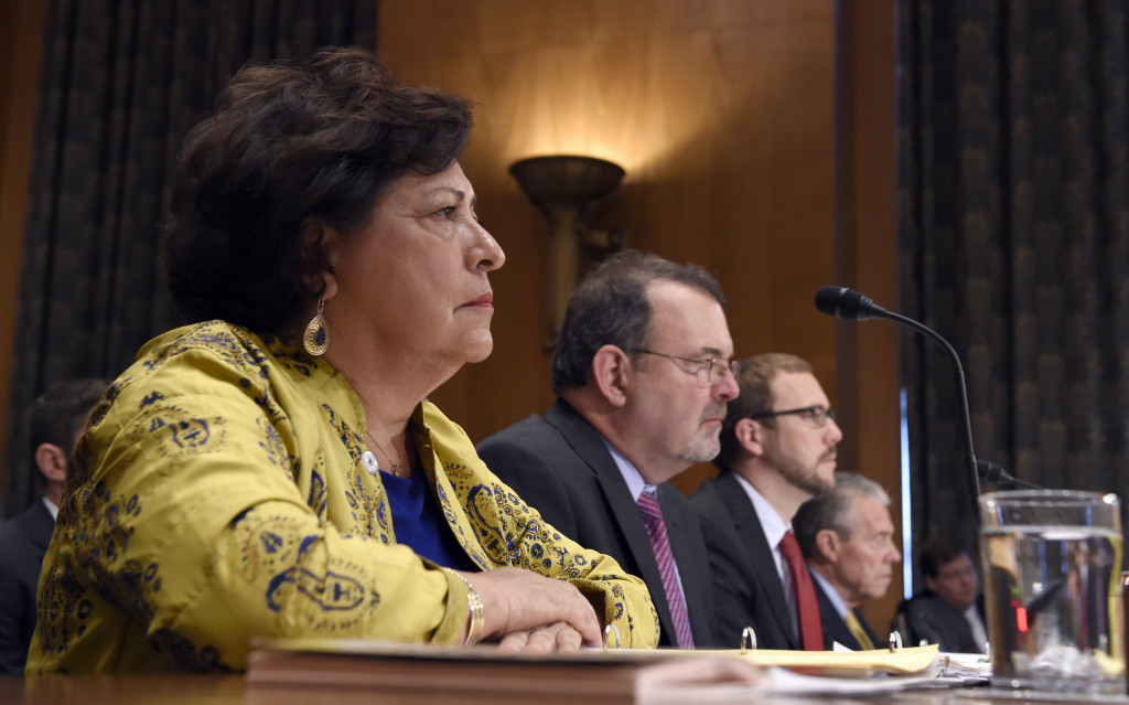Witnesses, from left, Office of Personnel Management (OPM) Director Katherine Archuleta; OPM Chief Information Officer Tony Scott; Assistant Secretary of Office of Cybersecurity and Communications National Protection and Programs Directorate at the Department of Homeland Security Andy Ozment, and OPM Inspector General Patrick E. McFarland, testify on Capitol Hill in Washington, Thursday, June 25, 2015, before the Senate Homeland Security and Governmental Affairs Committee hearing on federal Cybersecurity and the OPM Data Breach. (AP Photo/Susan Walsh)
