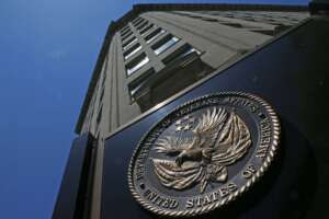 The seal a fixed to the front of the Department of Veterans Affairs building in Washington. (AP Photo/Charles Dharapak)
