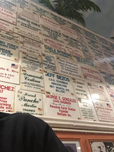 A wall in the Cuban Corner restaurant in Rockville, Maryland, showcases the contributions of Cuban-Americans. (Photo by Tom Temin)