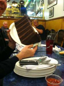 A large slab of chocolate cake at a New Jersey diner famous for its large food.